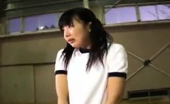 Pigtailed Asian schoolgirl works her lips and hands on a lo