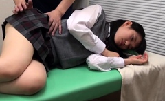 Japanese teen in schoolgirl uniform stripped